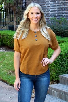 henley short sleeve knit top functional button tabs 100% cotton color: burnt orange our model Alex is 5'4 and wearing size Small. Short Sleeve Knit Top, Indian Music, Burnt Orange, Knit Top, V Neck, Boutique, Orange, Women's Top, Animals