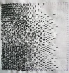 a piece of cloth with black and white designs on it, in the middle of an image