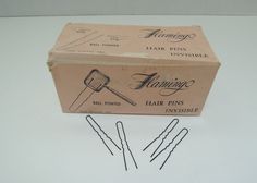 "Remember the spit curls, girls?????? When nothing other than our hair pins would do? Now you can have your own box of pins and bring back the spit curl days. Here we have a box of Flamingo 1 ¾\" invisible black crimped hair pins. The pins box is marked \"Made in France\". The box is marked 1 lb, but has been opened and some pins, not many, have been used and the box is almost full. The box has some wear but overall, it is in good condition. The clips are 1 ¾' long and the box is 5\" x 2 3/8\" x Black Crimped Hair, Spit Curls, Girls When, Pin Box, Crimped Hair, Candle Wall Sconces, Honeycomb Pattern, Bring Back, Beauty Shop