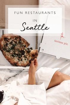 a person laying in bed with a pizza on top of it and the words fun restaurants in seattle above them