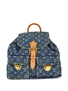 circa 2006 blue signature Monogram Denim canvas Vachetta leather trim single rolled top handle two adjustable shoulder straps foldover top with pin-buckle fastening top drawstring fastening two front flap pockets main compartment internal jetted pocket contrast lining logo-engraved gold-tone hardware Condition: EXCELLENT. This previously owned item is in near-perfect condition with no signs of damage or use. Purchasing this item continues its narrative and reduces the environmental impact by avoiding the use of new resources needed to make the product from scratch, such as water, materials and electricity, and avoiding additional manufacturing impact. Learn more about what makes a product Conscious on our Conscious Criteria page Vintage Louis Vuitton Handbags, Designer Handbags Louis Vuitton, Louis Vuitton Denim, Denim Backpack, Handbags Louis Vuitton, Chanel 2, Iconic Bags, Blue Backpack, Vintage Louis Vuitton