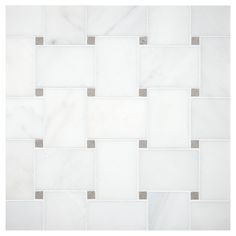 a white tile wall with grey and gray squares on it's sides, as well as an image of the floor