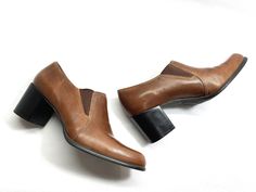 90's THICK BROWN LEATHER UPPERS CHUNKY BLOCK HEEL SLIP ON SHOES. HAS CHUNKY 2.5 INCH BLOCK HEELS FOR GREAT STABILITY. COMFORTABLE ROUNDED TOES AS SHOWN IN PICTURES. THIS IS A PAIR IS FROM THE 90's. GREAT FOR COSPLAY OR EVERYDAY. THEY ARE VERY CLEAN. VERY GENTLY WORN WITH VERY LIGHT WEAR AS SHOWN IN PICTURES. THE INSIDES ARE IMPECCABLY CLEAN. 100% INTACT THROUGHOUT. THEY HAVE A COUPLE VERY LIGHT SCUFFS AND CREASES ACROSS THE TOES BUT IT IS NOTHING MAJOR OR UGLY LOOKING. THEY ARE A SLIP ON STYLE W Womens Platform Shoes, Heels Vintage, Fossil Purse, Women Platform Shoes, Womens Mary Janes, Tan Shoes, Brown Leather Shoes, Mary Jane Shoes Womens, Foot Bed