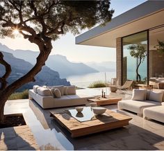 a living room filled with furniture next to a large glass window covered patio overlooking the ocean