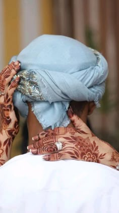 a woman with henna on her head