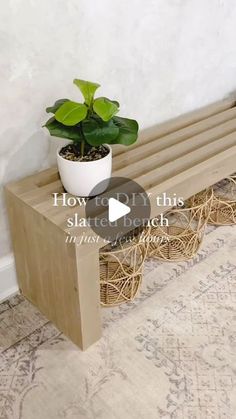 a potted plant sitting on top of a wooden bench next to a white wall