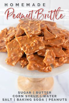 a white plate topped with peanut brittles on top of a table