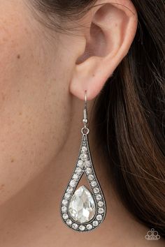 An oversized white teardrop gem is nestled inside the bottom of a ribbon of glittery white rhinestones, creating a dramatic lure. Earring attaches to a standard fishhook fitting.

 Sold as one pair of earrings. Diamond Chandelier, Fish Hook Earrings, Rhinestone Wedding, Paparazzi Accessories, White Rhinestone, Affordable Jewelry, Paparazzi Jewelry, White Earrings, Metal Earrings