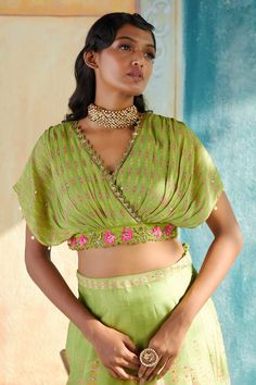 Green floral printed lehenga with placed hand embroidery. Paired with a matching placement embroidered draped blouse. - Aza Fashions V-neck Bollywood Sets For Navratri, Bollywood Style V-neck Sets For Navratri, Bollywood V-neck Sets For Navratri, Bollywood Lehenga With V-neck Unstitched Blouse, Traditional Silk V-neck Choli, Festive Silk V-neck Choli, V-neck Georgette Sets For Navratri, Georgette V-neck Sets For Navratri, Festive Bandhani Print V-neck Set