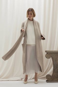 Elevate your cold-weather wardrobe with the Georgina longline cardigan. This open-front design is highlighted by its built-in scarf and ribbed cuffs, offering both warmth and sophistication. Crafted from plush cashmere, it‚Äôs a timeless piece with modern flair. 941 grams of 100% pure cashmere in 5-gauge knit Made in Italy Longline cardigan Scarf accent Open front Ribbed trim Slits at side 45" length (size small) Dry Clean Only Onyx Colour, Longline Cardigan, Cashmere Cardigan, Open Front Cardigan, Front Design, Long A Line, Timeless Pieces, Cold Weather, Scarf Wrap