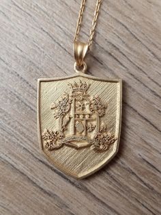 Personalized family crest round necklace. The disc can be engraved with your family crest, class logo or any other image or intials that you request. 1.INFORMATION ABOUT NECKLACE Available Chain Lengths: 16,18,20,22 inches Available in sterling silver, gold filled 1.2 Rings or other Jewellery Making Steps If you contact us and share the photo of the shape you want to personalize, we will respond in a very short time, then we will complete the design process and send you a draft.If you want, you Classic Engraved Medallion Necklace, Classic Medallion Necklace With Engraving Option, Engraved Shield-shaped Jewelry For Gifts, Engraved Shield Jewelry For Gift, Engraved Shield-shaped Jewelry Gift, Gift Engraved Shield Jewelry, Round Jewelry With Coat Of Arms For Gifts, Elegant Round Jewelry With Coat Of Arms, Classic Medallion Necklace As A Gift