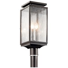 an outdoor post light with two lights on it