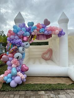 an inflatable arch decorated with balloons