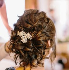 the back of a woman's head wearing a hair comb