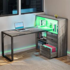 a computer desk with a laptop on top of it