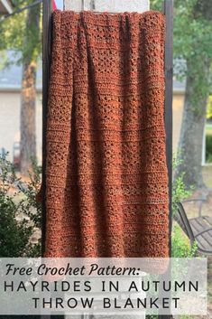 an orange crochet blanket hanging on a clothes line with the words free crochet pattern hayrises in autumn throw blanket