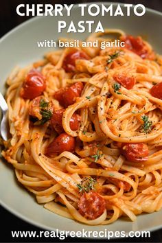 pasta with tomato sauce and garlic in a white bowl