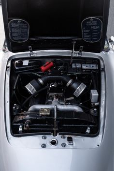 the engine compartment of a car with its hood open