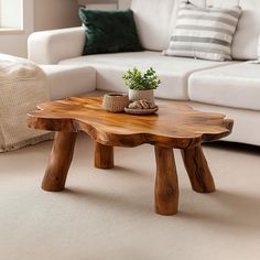 a wooden table sitting in front of a white couch