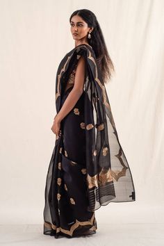 Charcoal black silk banarasi organza saree with gold floral zari buttis and gold arched border. Comes with an unstitched blouse piece. - Aza Fashions Bollywood Style Black Cotton Silk Pre-draped Saree, Black Cotton Silk Pre-draped Saree For Diwali, Black Tissue Silk Traditional Wear For Wedding, Black Tissue Silk Traditional Wedding Wear, Black Silk Pre-draped Saree With Sheer Dupatta, Elegant Black Saree For Transitional Season, Black Art Silk Traditional Wear With Sheer Dupatta, Elegant Black Chanderi Saree, Festive Black Tussar Silk Blouse Piece