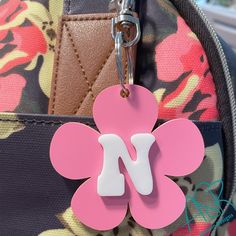 Back to school bag tag!!This personalized daisy keychain or bag tag is perfect to add to any bag, backpack, diaper bag or just add to your keychain. The perfect addition to anything you would like to personalize. Makes a great gift tag as well. Choose your acrylic color for the daisy as well as initial. Initial is such a cute a retro font.  Daisy is 2.5 inches and includes a lobster claw hook to easily attach to your bag. Each layer is laser cut from acrylic. Thank you for stopping by my shop an Pink School Bag With Keychain, Cute Rectangular School Keychains, Personalized Pink Luggage Tag For School, Daisy Keychain, Back To School Bag, Daisy Bags, Backpack Diaper Bag, Back To School Bags, Backpack Tags