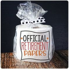 a roll of toilet paper wrapped in plastic with the words official retirement papers on it