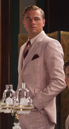 a man in a pink suit and tie