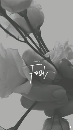 a black and white photo of flowers with the words food written on it's side