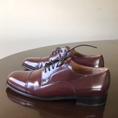 - Designer = Bostonian Classic. -Size =8.5m . Trunk 35 - Msrp = $110 - Glossy Burgundy Genuine Leather Upper. - Man Made Outsole. - Lace Up Cap Toe Oxford Shoes. Trunk 35 Elegant Fitted Lace-up Derby Shoes, Elegant Fitted Lace-up Derby, Fitted Almond Toe Dress Shoes With Rubber Heel Cap, Classic Cap Toe Dress Shoes For Spring, Fitted Derby With Rubber Heel Cap And Plain Toe, Fitted Closed Toe Oxfords For Spring, Fitted Burgundy Dress Shoes With Round Toe, Classic Fitted Closed Toe Dress Shoes, Classic Spring Oxfords