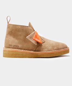 Nathan Clark created his two iconic styles, The Desert Boot and The Wallabee, in 1950 and 1967 respectively. For this exclusive collaboration, Todd winterized them by giving them a shearling lining, a hairy suede exterior and refreshing them in vintage military colors - Olive and Khaki. There are also pops of orange between the sole and insole. While these boots are often thoughts of as summer footwear, we think they look chic year-round whether you're wearing them with denim, cords or dressing Military Color, Clarks Boots, Summer Footwear, Desert Boot, Todd Snyder, Savile Row, Vintage Military, Boot Brands, Desert Boots