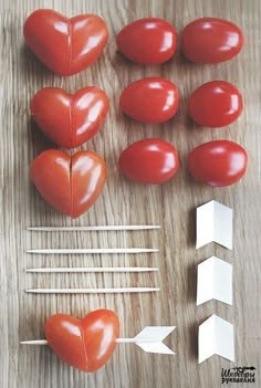 tomatoes, marshmallows and toothpicks arranged in the shape of hearts