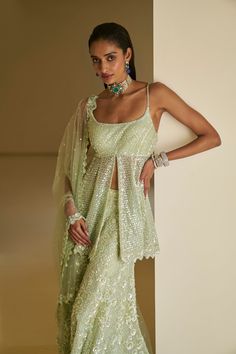 This sharara set features all-over delicate sequin embroidery on a mint green net base. The outfit is paired with a full embroidered peplum top and a matching dupatta.From Seema Gujral's Fiori - the sharara edit collection. DELIVERY TIMEPlease allow 8-12 weeks for your outfit to arrive. FABRIC DETAILSNet Professional cleaning only. Indian Wedding Outfits Mehndi, Indian Wedding Cocktail Outfits, Cocktail Party Outfit Indian, Sharara Ideas, Sequin Sharara, Mirror Lehenga, Mendhi Outfit, Bridesmaid Indian, Lengha Blouse