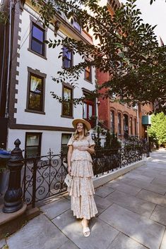 A floral print chiffon maternity maxi dress featuring a square neckline, a smocked elastic top, short puff sleeves, a ruffle layered skirt and double lined. Floral Print Chiffon, Floral Squares, Layered Skirt, Neck Ruffle