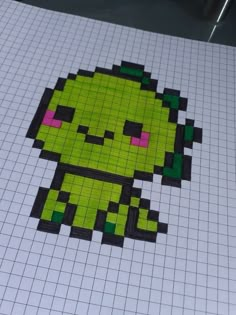 an image of a pixel art piece on top of a white sheet of graph paper