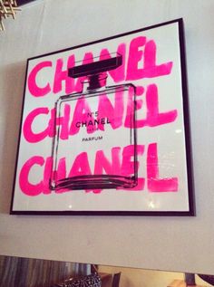 a chanel advertisement is displayed on the wall