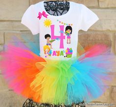 a t - shirt with the letter h on it and rainbow tutule skirt