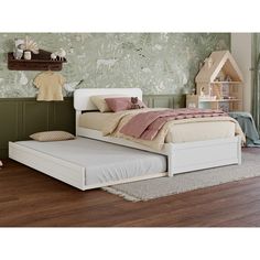 a child's bedroom with green wallpaper and wooden flooring, including a white bed