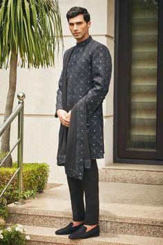 Black sherwani with floral Mughal chikankari embroidery and sequin highlights. Comes with matching dupatta, short kurta and pant.
Components: 4
Pattern: Embroidered
Type Of Work: Chikankari, Sequins
Neckline: Mandarin
Sleeve Type: Straight Full
Fabric: Sherwani and Dupatta- Georgette, Kurta and Pant- Terrywool
Color: Black
Other Details: 
Model height: 6ft, wearing size M
Occasion: Cocktail and Reception - Aza Fashions Festive Designer Sherwani With Chikankari Embroidery, Festive Designer Kurta With Chikankari Embroidery, Festive Sherwani With Chikankari Embroidery For Eid, Eid Traditional Sherwani With Chikankari Embroidery, Eid Festive Sherwani With Chikankari Embroidery, Festive Eid Sherwani With Chikankari Embroidery, Eid Bandhgala With Chikankari Embroidery, Designer Kurta With Mirror Work For Eid, Designer Eid Kurta With Mirror Work