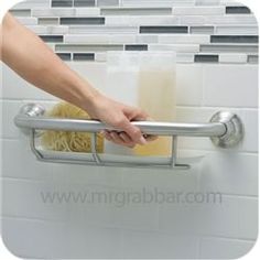 a person is holding onto the handle of a towel rack with pasta in front of them