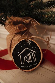 a christmas ornament hanging from the top of a tree