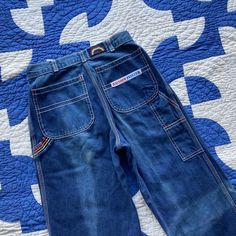 "Coolest painter / carpenter style jeans with rainbow details, interesting fades and cute zipper pull! In good condition but with fading throughout, as shown. Waist: 24\"-25\" taut Rise: 11\" Inseam: 30.5\" Hip: 37/38\" Please ask any questions before purchasing, especially concerning fit or condition. All items are vintage and in condition as described. Shipping via USPS Priority Mail unless otherwise agreed upon. All sales final, no returns- Thank You from Collecting Dust!" Retro Mid-rise Rigid Denim Bottoms, 70s Patchwork Jeans, 1970s Wide Leg Denim Jeans, Non-stretch Wide Leg Patchwork Jeans, 1970s Full-length Denim Jeans, 70s Denim, Painters Pants, Carpenter Jeans, Jeans Style