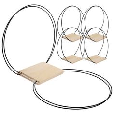 three circular metal shelves with wooden boards and wire on each side, along with two circles that are connected to the same wall