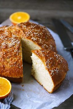 an orange cake with one slice cut out