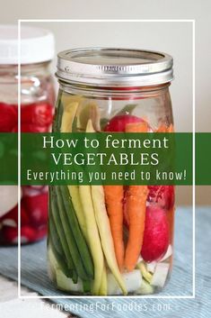 a jar filled with vegetables sitting on top of a table