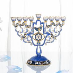 an ornate blue and gold menorah on a table