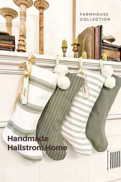 three stockings hanging from a fireplace with books on the mantle