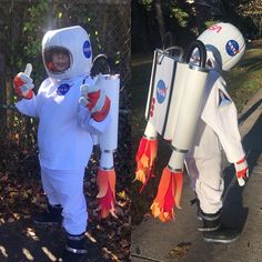 two children dressed as astronauts holding rockets