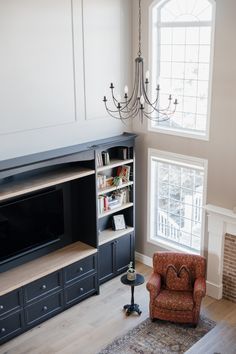 a living room filled with furniture and a fire place