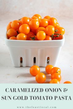 a white bowl filled with orange tomatoes on top of a table next to the words caramelized onion and sun gold tomato pasta