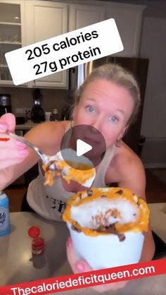 a woman eating a bowl of food with a spoon